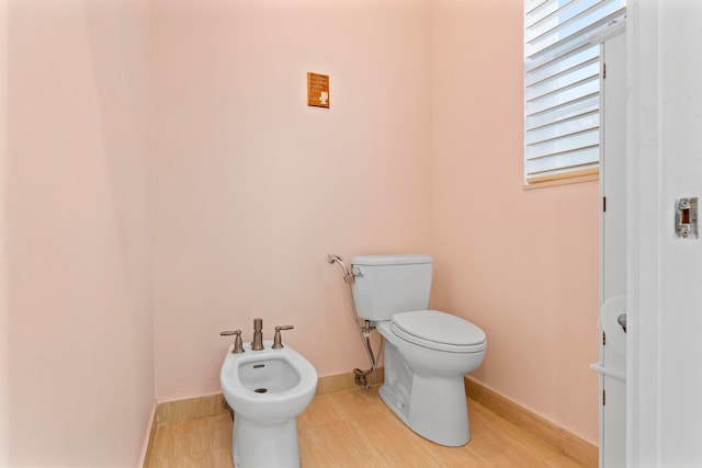 bathroom featuring a bidet and toilet