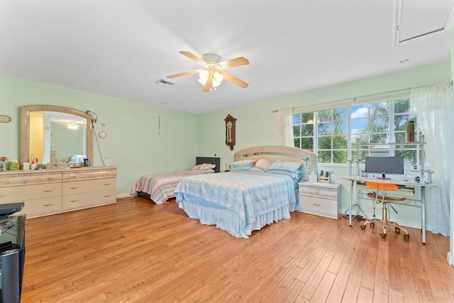 bedroom with light hardwood / wood-style flooring and ceiling fan