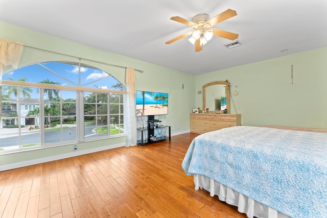 bedroom with light wood-type flooring and ceiling fan