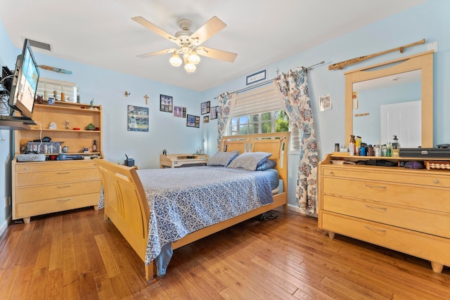 bedroom featuring ceiling fan and hardwood / wood-style flooring