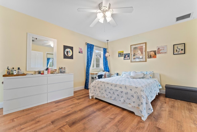 bedroom featuring light wood-type flooring and ceiling fan