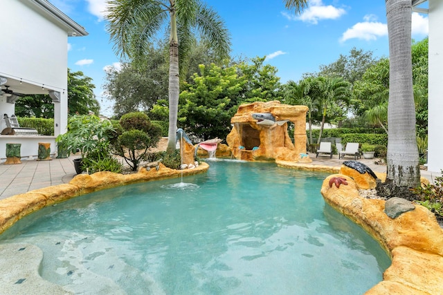 view of swimming pool featuring a patio and ceiling fan