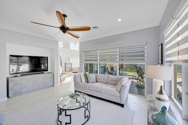 tiled living room featuring crown molding, a healthy amount of sunlight, and ceiling fan