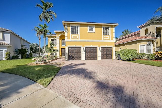 view of front facade featuring a front lawn and a garage