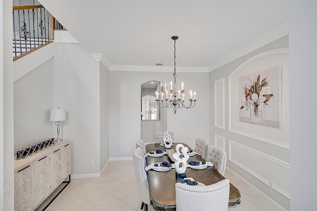 dining room featuring ornamental molding and a notable chandelier