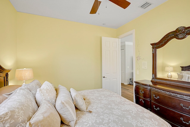 bedroom featuring hardwood / wood-style flooring and ceiling fan