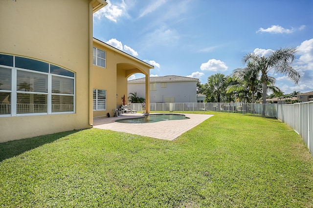 view of yard with a patio and a fenced in pool