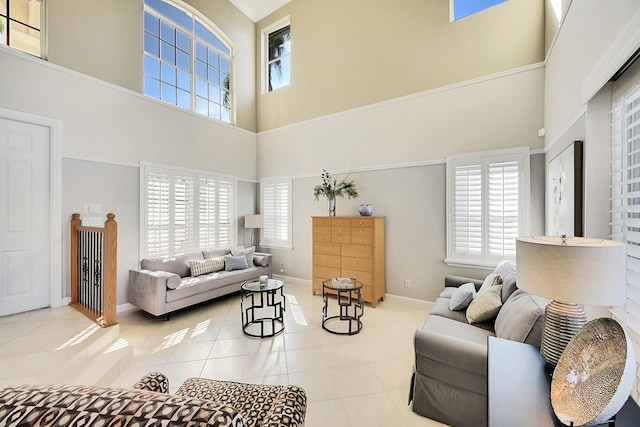 living room with light tile patterned flooring and a high ceiling