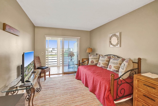 bedroom with access to outside and light hardwood / wood-style floors