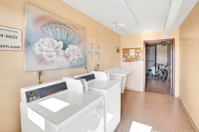 laundry area with washing machine and dryer