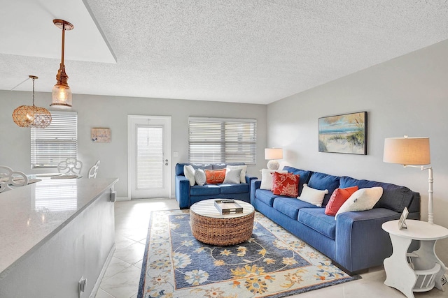 tiled living room with a textured ceiling