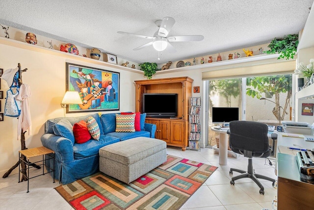 home office with a textured ceiling, light tile patterned floors, and ceiling fan