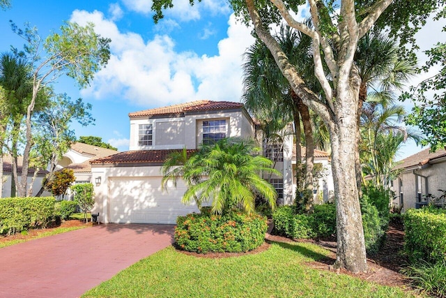 mediterranean / spanish-style home featuring a garage