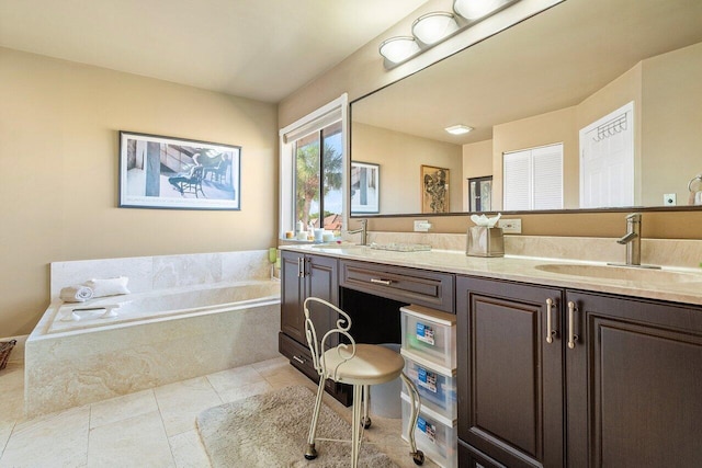 bathroom featuring vanity, tile patterned flooring, and tiled bath