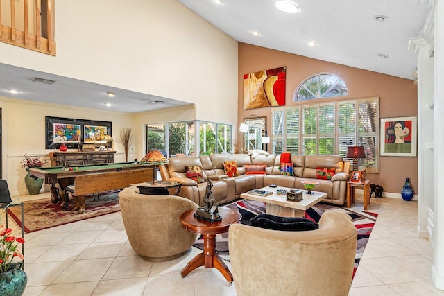 tiled living room featuring pool table, a textured ceiling, and high vaulted ceiling