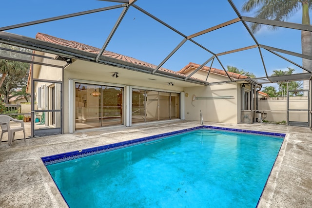 view of pool featuring a lanai and a patio area