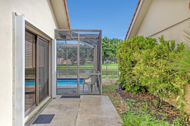 view of patio / terrace featuring a fenced in pool and a lanai