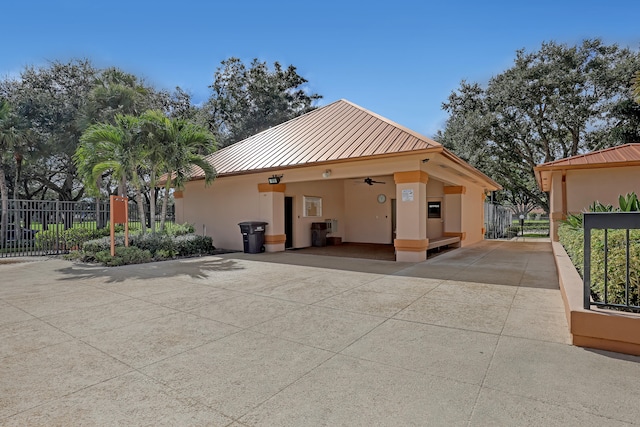 exterior space featuring ceiling fan