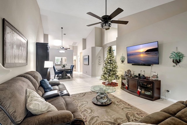 living room featuring high vaulted ceiling, ceiling fan, and light tile patterned floors