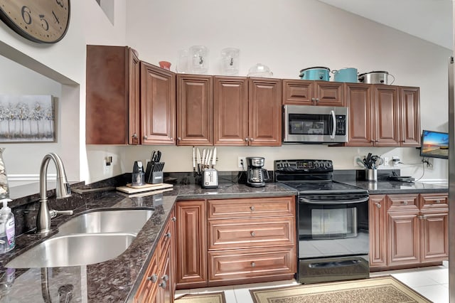 kitchen featuring light tile patterned flooring, sink, black / electric stove, dark stone countertops, and vaulted ceiling