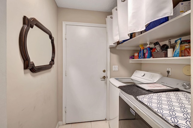 laundry area with separate washer and dryer