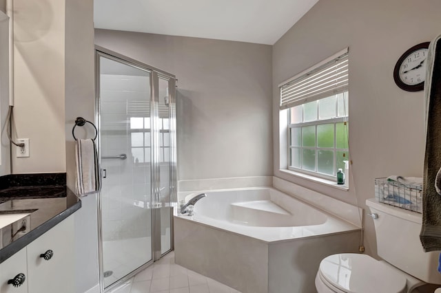 full bathroom with vanity, toilet, plus walk in shower, tile patterned floors, and vaulted ceiling