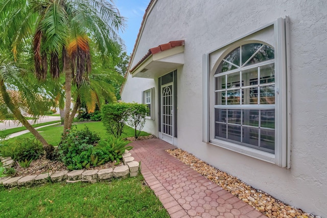 view of side of home featuring a lawn