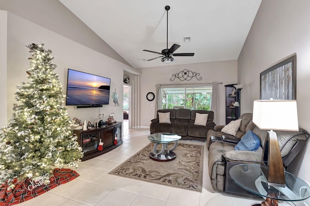 living room featuring light tile patterned flooring, vaulted ceiling, and ceiling fan