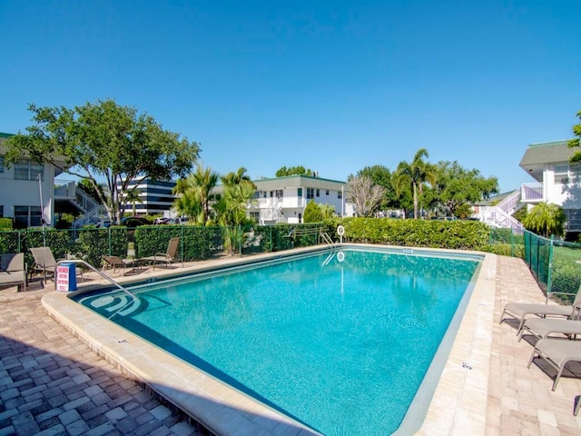 view of swimming pool featuring a patio