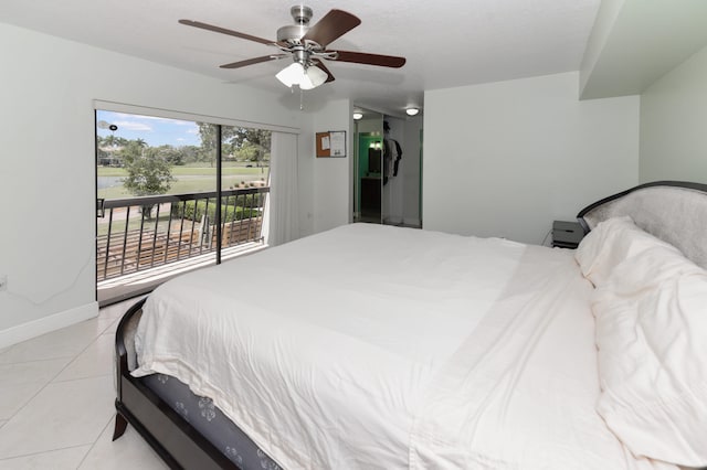 tiled bedroom featuring ceiling fan, a textured ceiling, and access to exterior