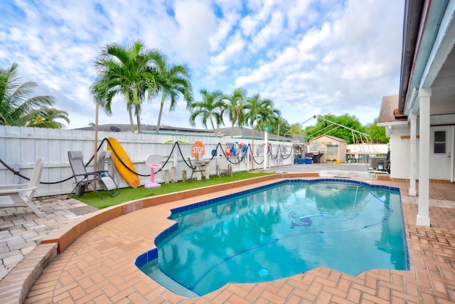 view of pool featuring a patio area