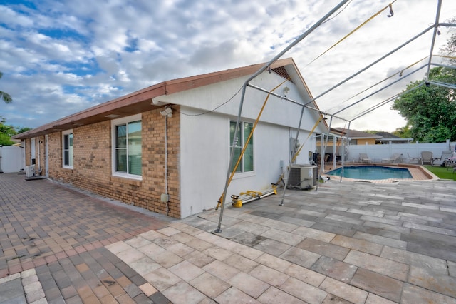 exterior space with a patio and central AC