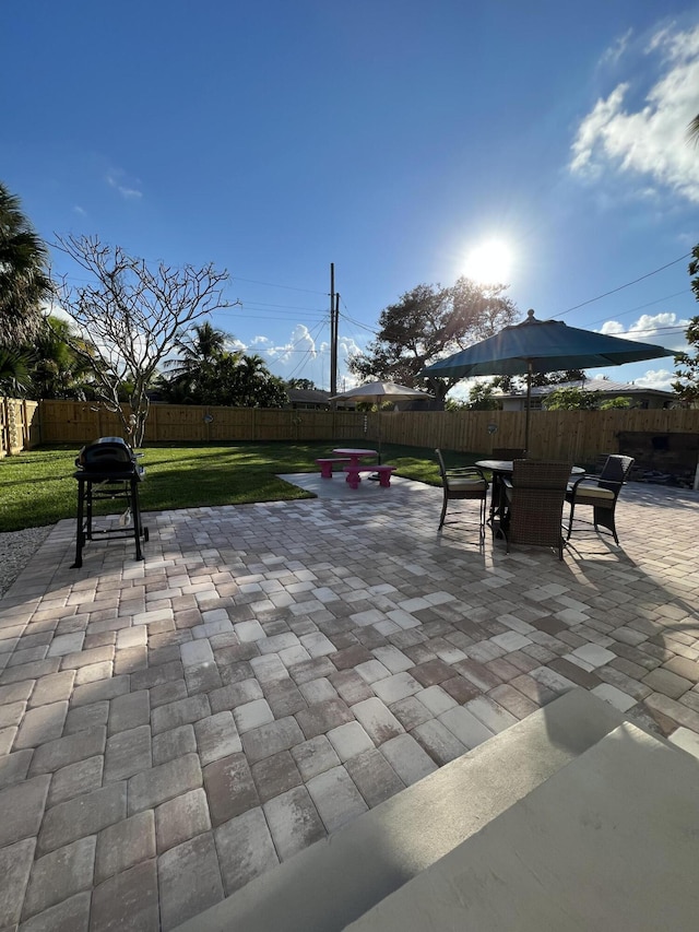 view of patio featuring a grill