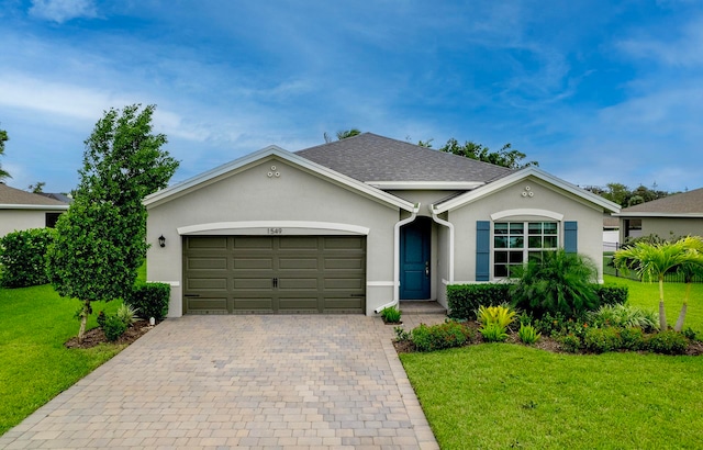 ranch-style house with a garage and a front lawn