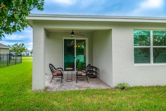 exterior space featuring ceiling fan, a yard, and a patio