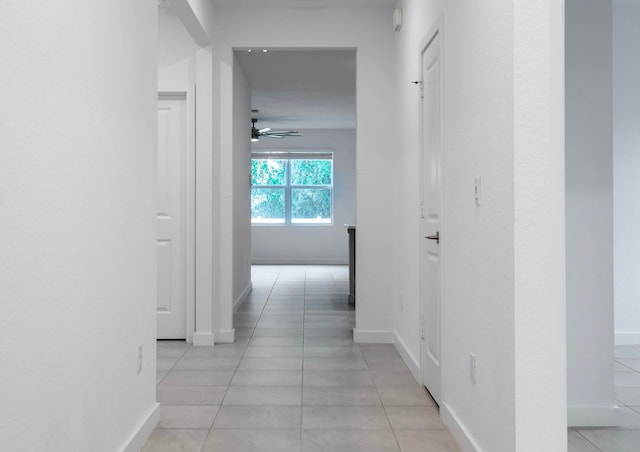 hallway with light tile patterned flooring