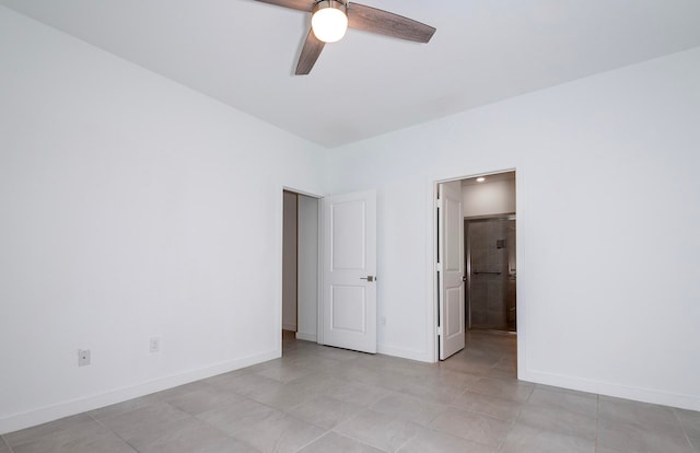 unfurnished bedroom featuring ceiling fan and light tile patterned floors