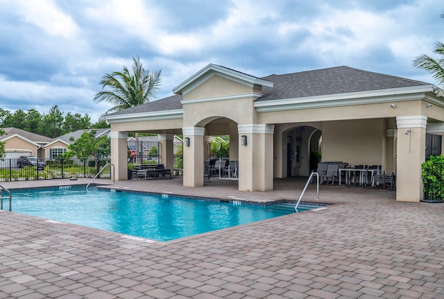 view of swimming pool with a patio