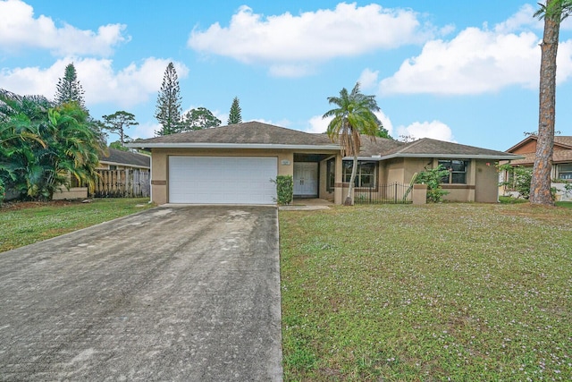 ranch-style house featuring a front yard and a garage