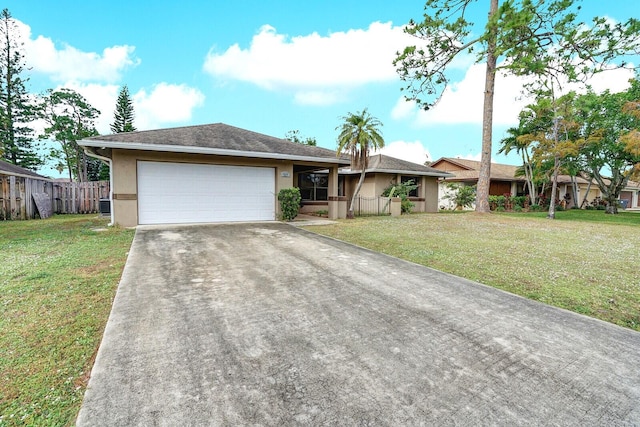 ranch-style home featuring a garage, central air condition unit, and a front lawn