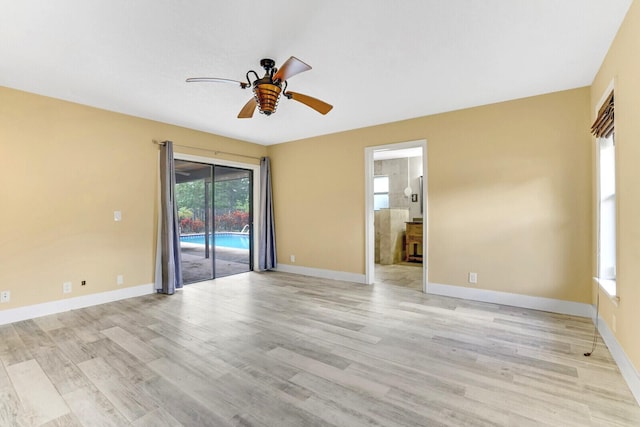 unfurnished room with ceiling fan and light hardwood / wood-style floors