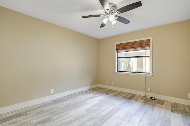 empty room featuring ceiling fan and light hardwood / wood-style floors