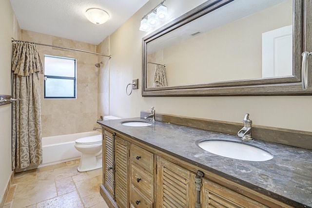 full bathroom featuring shower / bath combination with curtain, toilet, and vanity