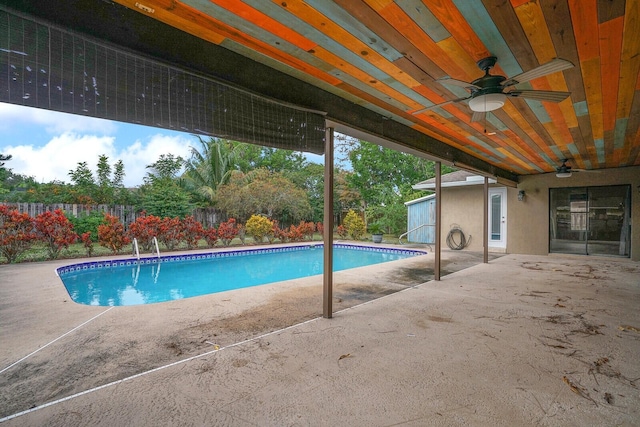 view of pool featuring ceiling fan and a patio