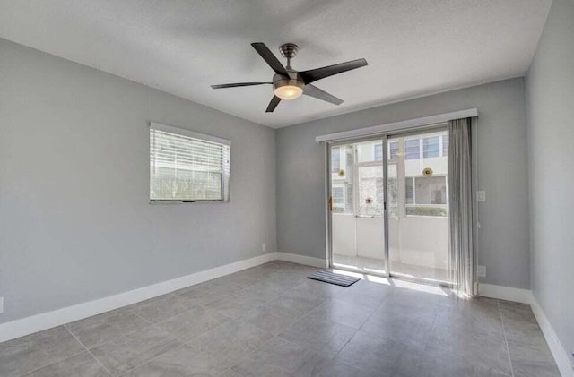 632 Monaco N, Delray Beach, FL 33446 - spare room with a ceiling fan, baseboards, and tile patterned floors