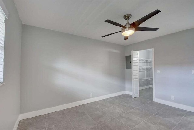 632 Monaco N, Delray Beach, FL 33446 - empty room featuring ceiling fan, baseboards, tile patterned flooring, and electric panel