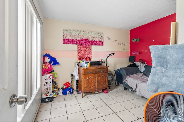 bedroom with light tile patterned floors