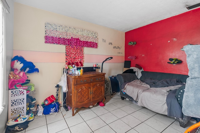 bedroom featuring light tile patterned floors