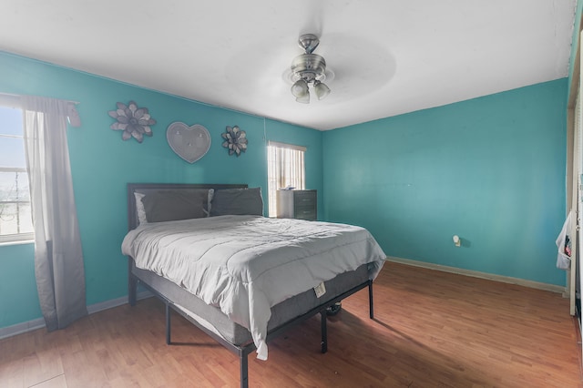 bedroom featuring ceiling fan and hardwood / wood-style floors