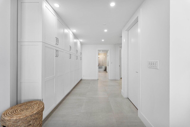 corridor with light tile patterned floors